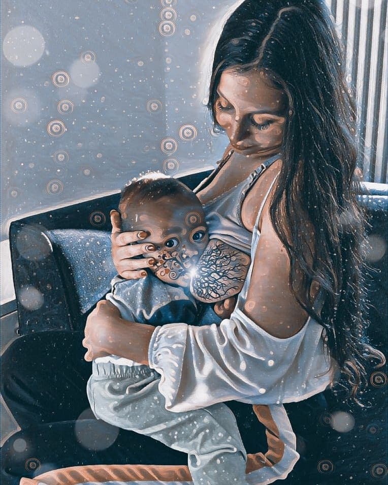 Tree of Life photo showing mother cradling baby with detailed tree branches